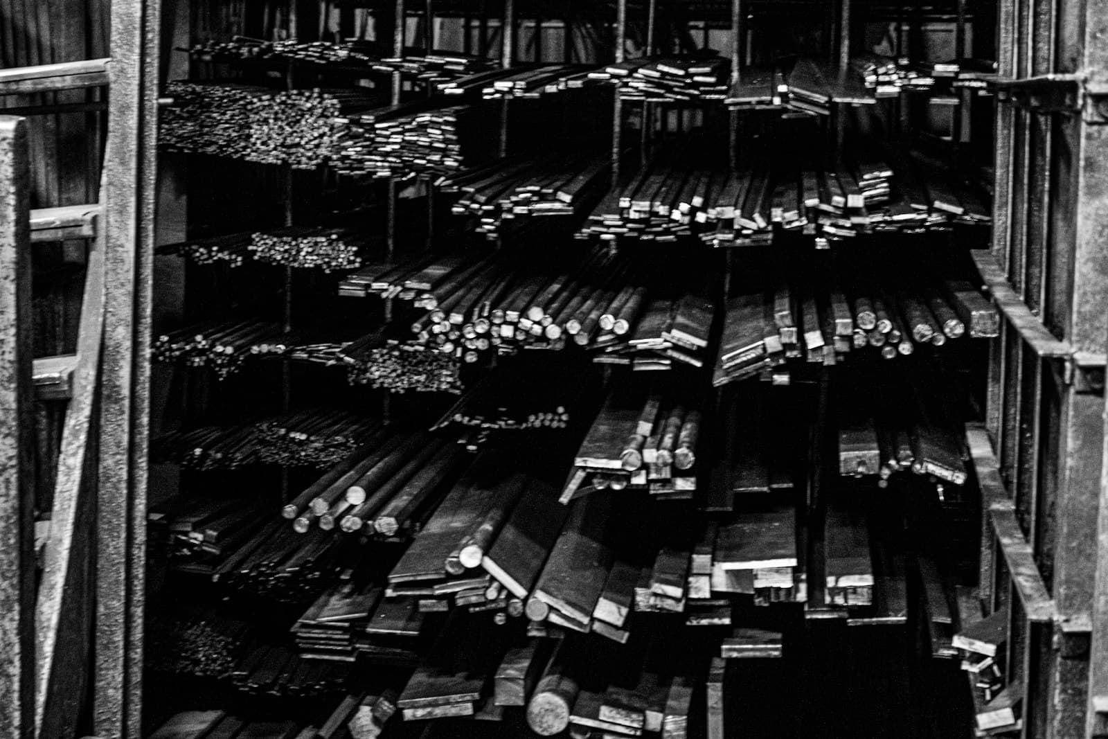 Metal bars stacked neatly in a warehouse