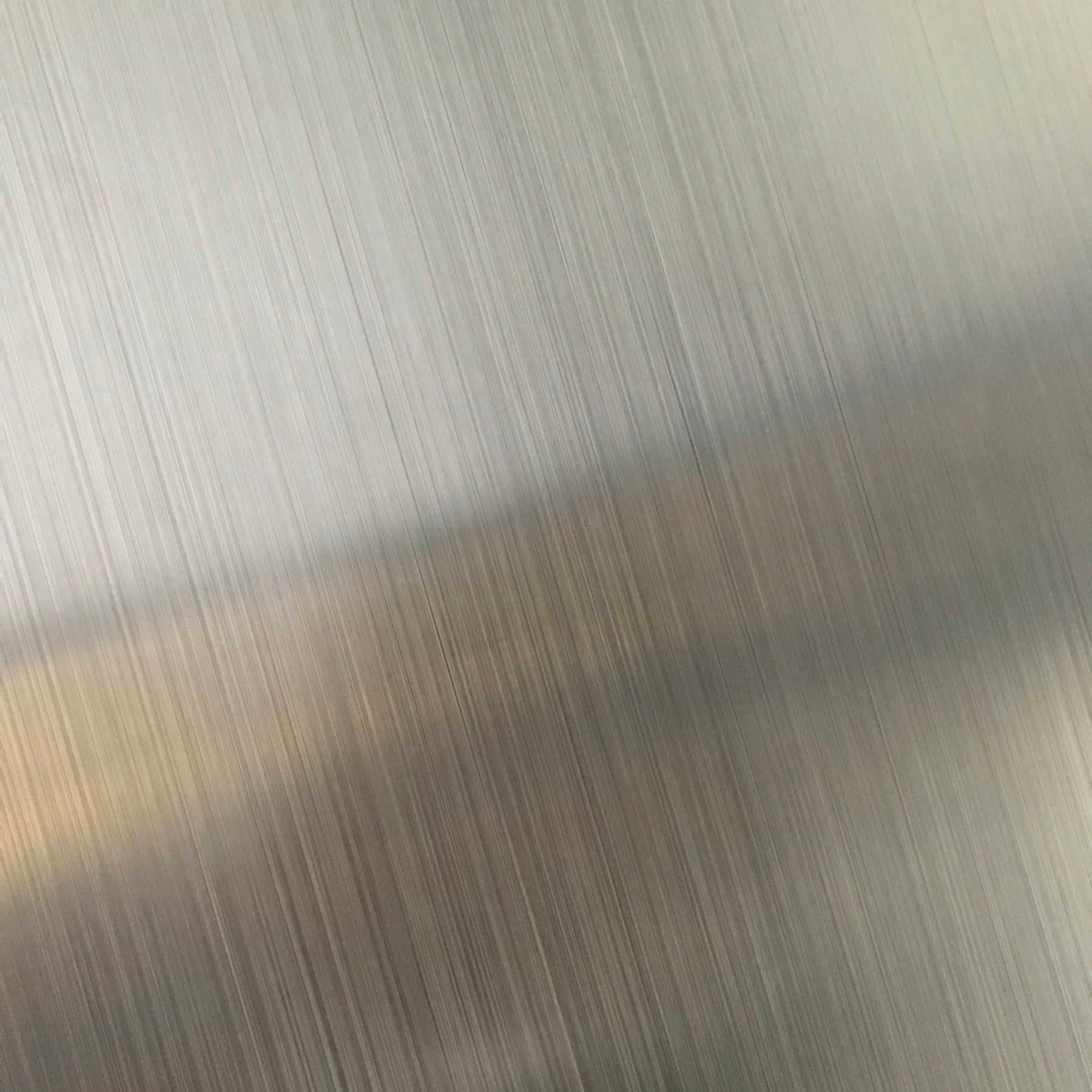 Brushed metal surface with fine vertical lines